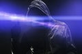 Computer hacker in hoodie using virtual screen. Database hacking, computer virus malware and cybersecurity concept