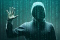 Computer hacker in mask and hoodie over abstract binary background. Obscured dark face. Data thief, internet fraud