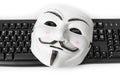 Computer hacker mask and keyboard