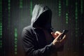 Computer hacker with mobile phone
