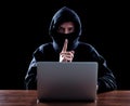 Computer hacker stealing data from laptop Royalty Free Stock Photo