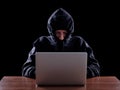 Computer hacker stealing data from laptop Royalty Free Stock Photo