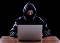 Computer hacker stealing data from laptop Royalty Free Stock Photo