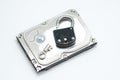 Computer hard disks and open metal padlock concept for encrypted data, cyber security on white background Royalty Free Stock Photo