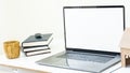 The computer has a white screen and a white background on the table with coffee mugs and house Royalty Free Stock Photo