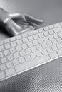 Computer keyboard aluminum silver hand Royalty Free Stock Photo