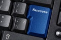 Computer keyboard blue key with Success label inscription. Business concept. Close up image