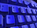 Computer keyboard in blue light. Royalty Free Stock Photo