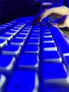 Computer keyboard in blue light. Royalty Free Stock Photo