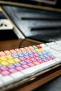 computer keyboard with colored and mixed keys for audio and video editing. professional keyboard with shortcuts to facilitate