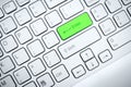 Computer keyboard with green button Royalty Free Stock Photo