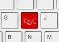 Computer keyboard with handshake button Royalty Free Stock Photo