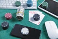 Computer keyboard, money, mouse, playing cards and chips. Online casino