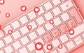 Computer keyboard with pink heart symbol icon and on pink background Royalty Free Stock Photo