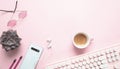 Computer keyboard and succulent plant against pink background Royalty Free Stock Photo