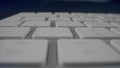 Computer keyboard with white keys. White buttons of computer keyboard in detail Royalty Free Stock Photo