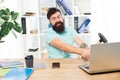 Computer lag. Reasons for computer lagging. How fix slow lagging system. Hate office routine. Man bearded guy headphones Royalty Free Stock Photo