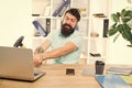 Computer lag. Reasons for computer lagging. How fix slow lagging system. Hate office routine. Man bearded guy headphones Royalty Free Stock Photo