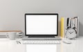 Computer laptop blank screen on white office desk, workspace mock up design illustration 3D rendering Royalty Free Stock Photo