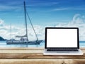 Computer laptop with blank white screen on wooden table Royalty Free Stock Photo