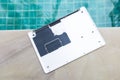 Computer laptop cover on swimming pool edge, computer part Royalty Free Stock Photo