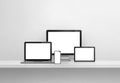 Computer, laptop, mobile phone and digital tablet pc. white concrete shelf banner Royalty Free Stock Photo