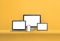 Computer, laptop, mobile phone and digital tablet pc. yellow shelf banner Royalty Free Stock Photo