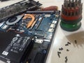 took apart the laptop for repair, added ram, and cleaned the fan and motherboard