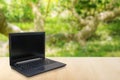 Computer Laptop on the table blur background with bokeh Royalty Free Stock Photo