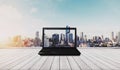 Computer laptop on white wood floor with Bangkok city view in sunrise background Royalty Free Stock Photo