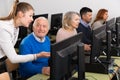 Young woman instructing smiling senior man