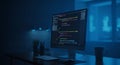 Computer Monitor Displaying Code in Dimly Lit Modern Workspace Royalty Free Stock Photo