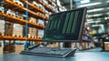 Computer monitor displaying inventory management software in a warehouse setting Royalty Free Stock Photo