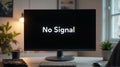 Computer Monitor Displaying No Signal Message in Modern Office Royalty Free Stock Photo