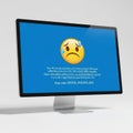 Computer monitor displaying a sad emoji and error message isolated on white background Royalty Free Stock Photo