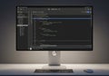 A computer monitor displays code in an integrated development environment (IDE) with a dark theme. Royalty Free Stock Photo