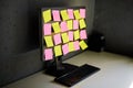 Computer monitor full of colorful sticky notes reminders Royalty Free Stock Photo