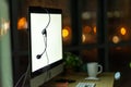 Computer monitor and headset in customer service call center workstation