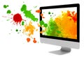 Computer monitor with paint blots and splashes on white background