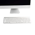 Computer monitor and wireless keyboard on white background technology screen Royalty Free Stock Photo