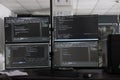 Computer monitors on desk compiling programming html data Royalty Free Stock Photo