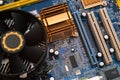 Computer motherboard with cooling system and fan. Computer details and diagrams. Equipment for the work of an engineer Royalty Free Stock Photo