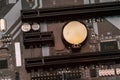 Computer motherboard. Empty slots for RAM. Computer battery. Microcircuit close up Royalty Free Stock Photo
