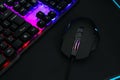 Computer mouse, mousepad and RGB keyboard on dark background, closeup Royalty Free Stock Photo