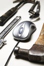 Computer mouse and old tools Royalty Free Stock Photo