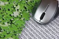 computer mouse, puzzles and binary code Royalty Free Stock Photo