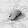 Computer mouse with a smooth curved design featuring a white top and Royalty Free Stock Photo