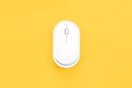Computer mouse on a yellow background isolated, flat lay. Royalty Free Stock Photo