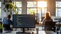 computer with multiple monitors displaying code in a dimly lit environment, suggesting a focus on programming or Royalty Free Stock Photo