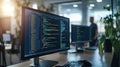 computer with multiple monitors displaying code in a dimly lit environment, suggesting a focus on programming or Royalty Free Stock Photo